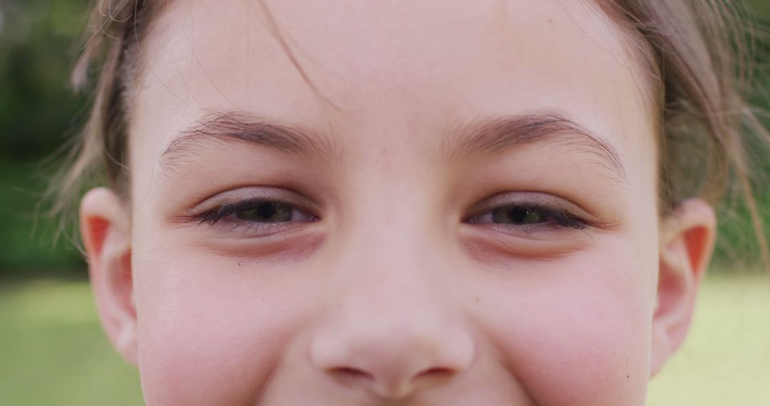 Close-Up of Smiling Young Caucasian Girl Outdoors - Free Images, Stock Photos and Pictures on Pikwizard.com