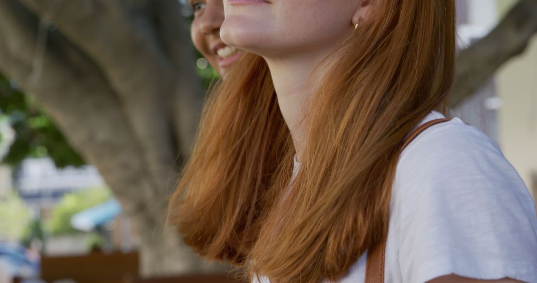 Smiling Redhead Women Enjoying Outdoors in Park - Free Images, Stock Photos and Pictures on Pikwizard.com