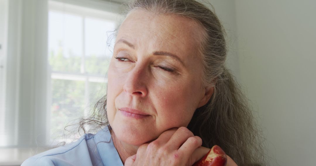 Concerned Elderly Woman Thinking at Home by Window - Free Images, Stock Photos and Pictures on Pikwizard.com