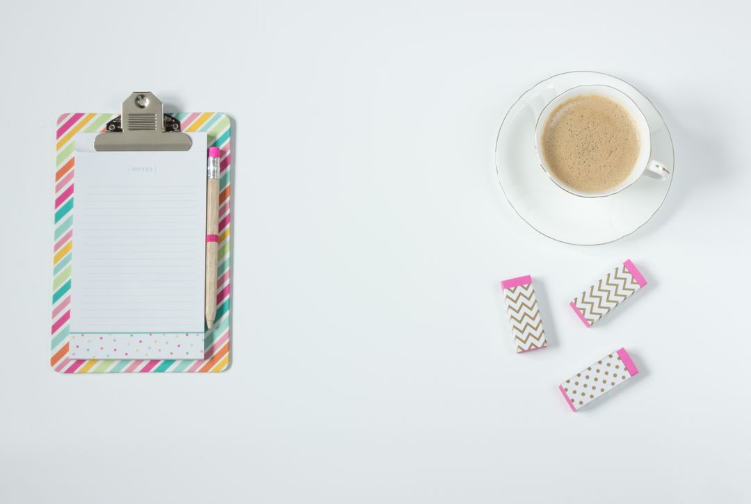 Colorful Clipboard with Notepad and Cup of Coffee on White Desk - Free Images, Stock Photos and Pictures on Pikwizard.com