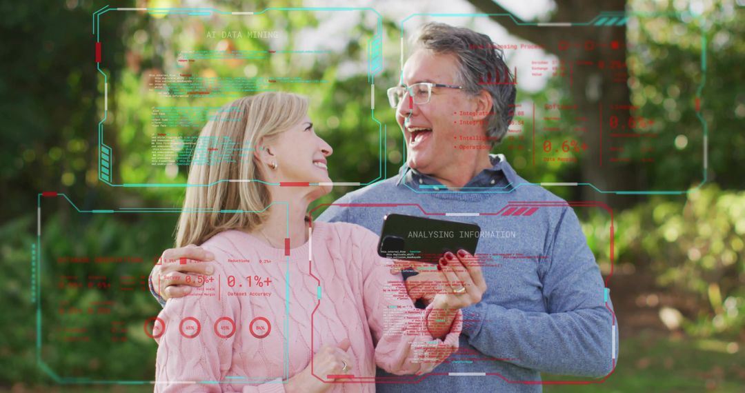 Laughing mature couple using smartphone with augmented reality HUD in sunny garden