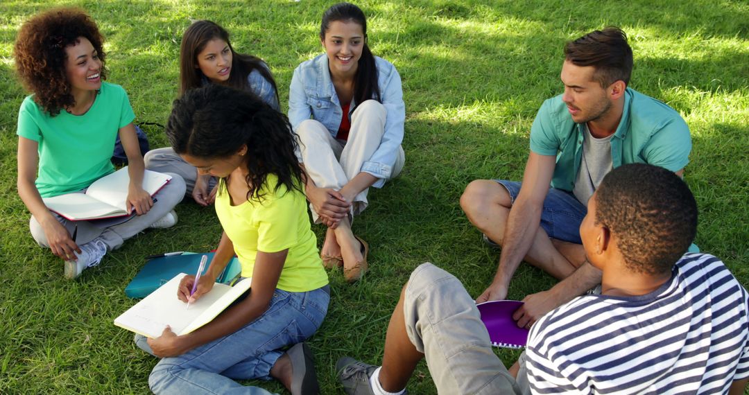 Diverse Group of Students Studying Together Outdoors on Grass - Free Images, Stock Photos and Pictures on Pikwizard.com