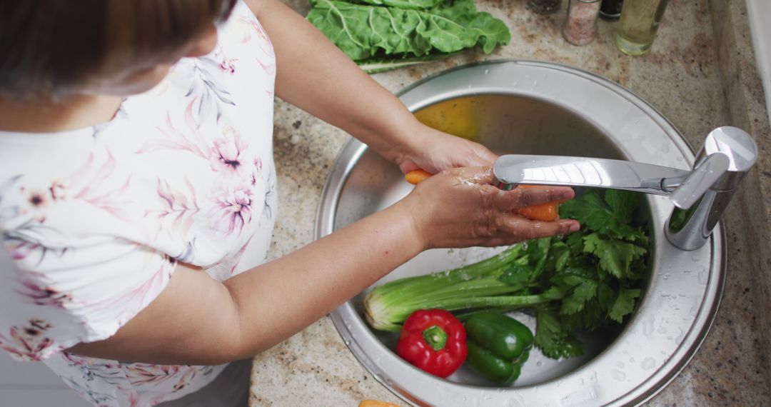 Woman Washing Fresh Vegetables in Kitchen Sink - Free Images, Stock Photos and Pictures on Pikwizard.com