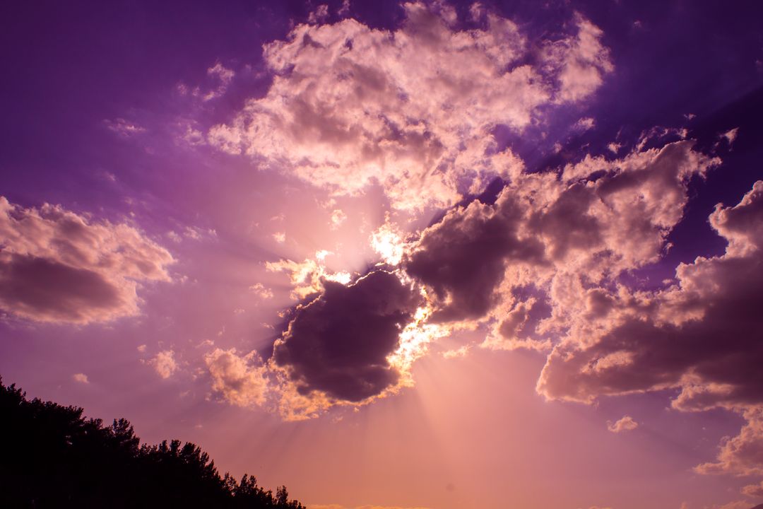 Dramatic Sunset with Radiant Clouds and Purple Sky - Free Images, Stock Photos and Pictures on Pikwizard.com