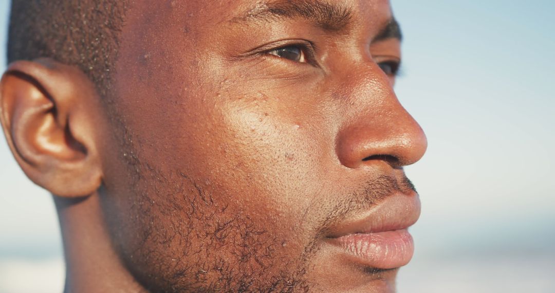 Close-Up Portrait on Beach with Gentle Serenity