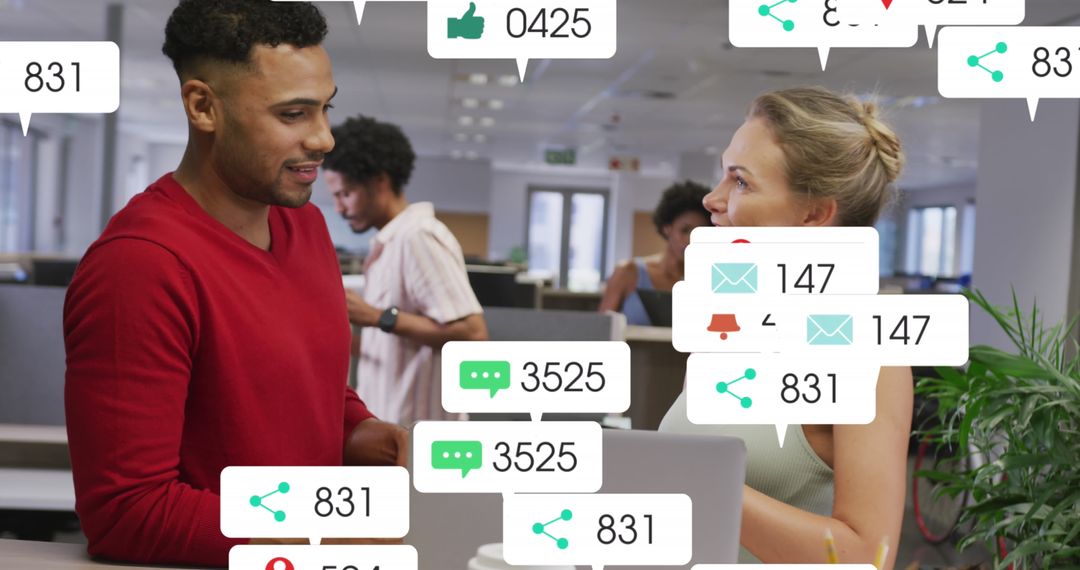 Diverse Colleagues Analyzing Social Media Notifications in Modern Office