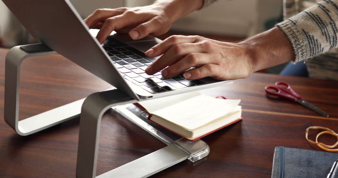 Person Typing on Laptop with Stand in Home Office - Free Images, Stock Photos and Pictures on Pikwizard.com