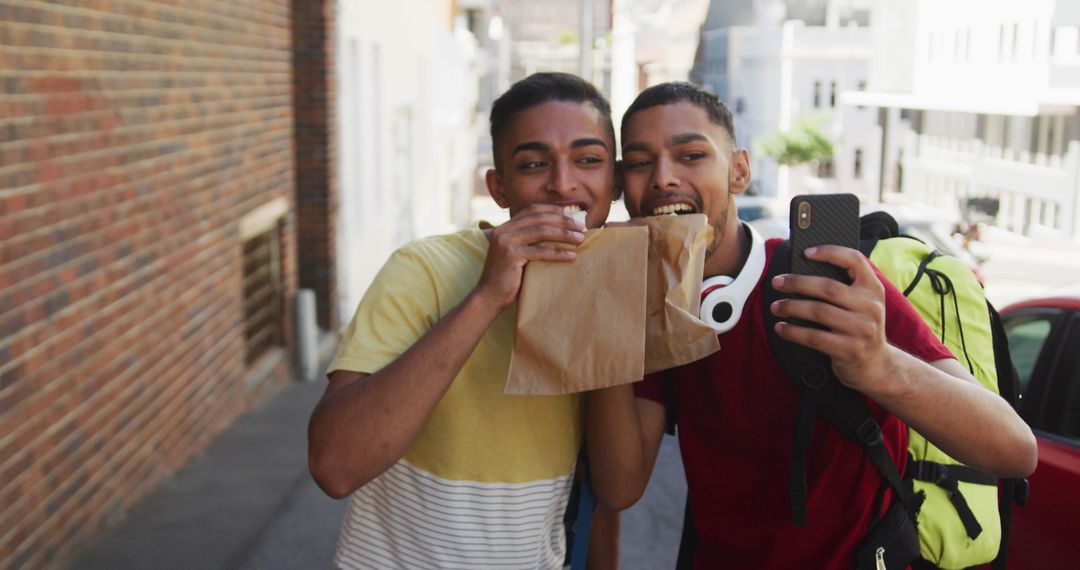 Smiling Friends Taking Selfie Sharing Snack Backpacking Adventure