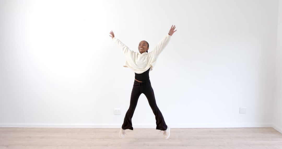 Energetic Dance in Minimalist Room Conveying Joy and Freedom