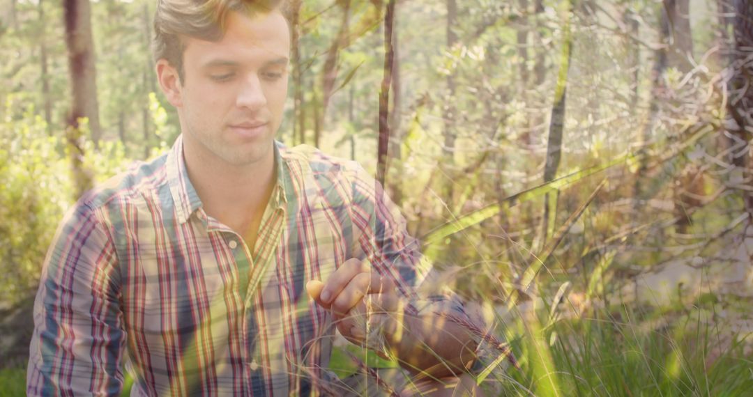 Young Man Exploring Lush Forest Environment