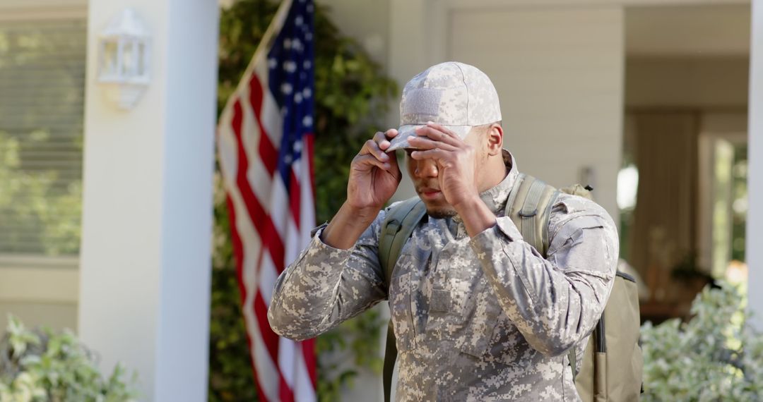 Soldier Coming Home in Uniform Standing Next to American Flag - Free Images, Stock Photos and Pictures on Pikwizard.com