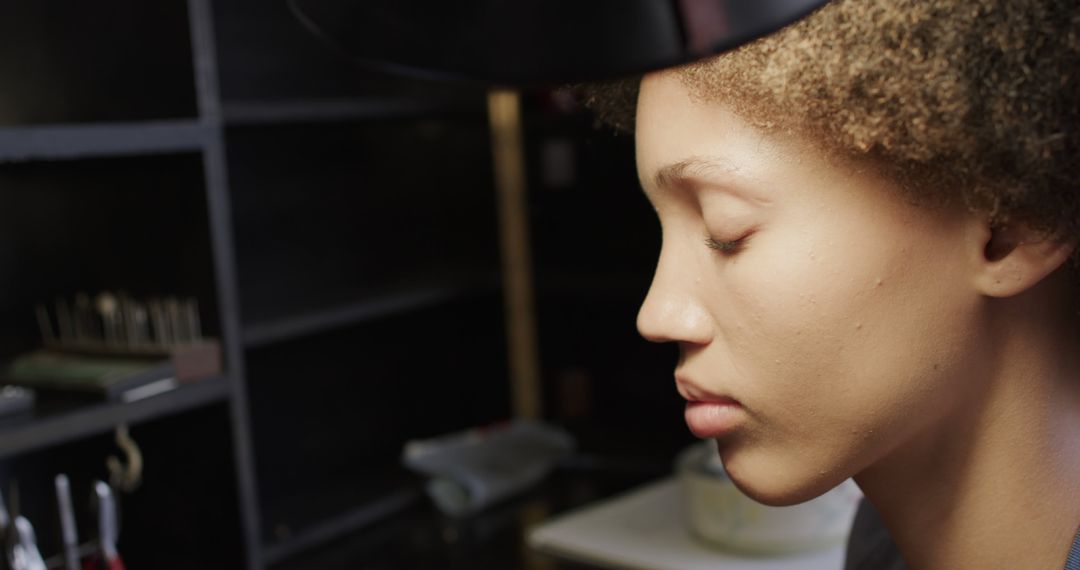 Jeweller Focused on Crafting in Workshop Environment