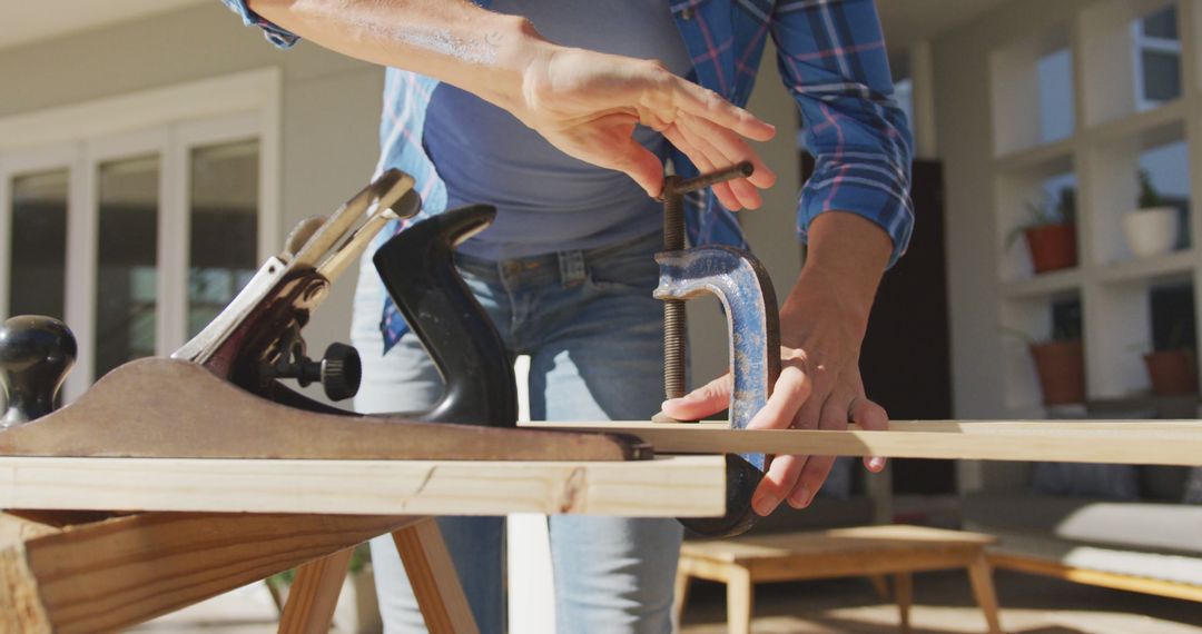 Person Utilizing Clamp and Hand Plane in Woodworking Project - Free Images, Stock Photos and Pictures on Pikwizard.com