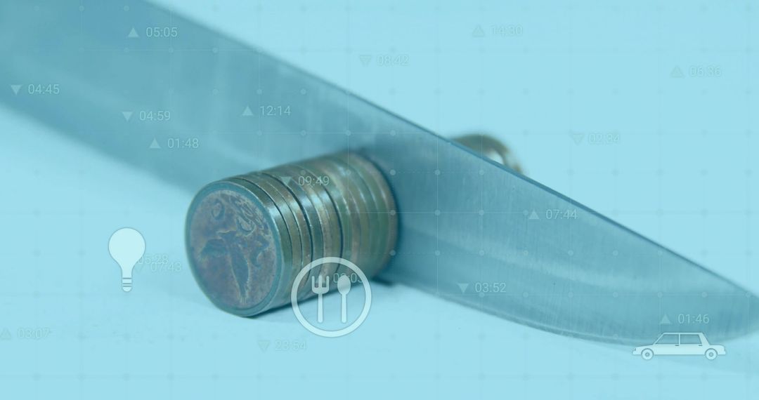 Cutting Coins with Knife Symbolizing Financial Challenges