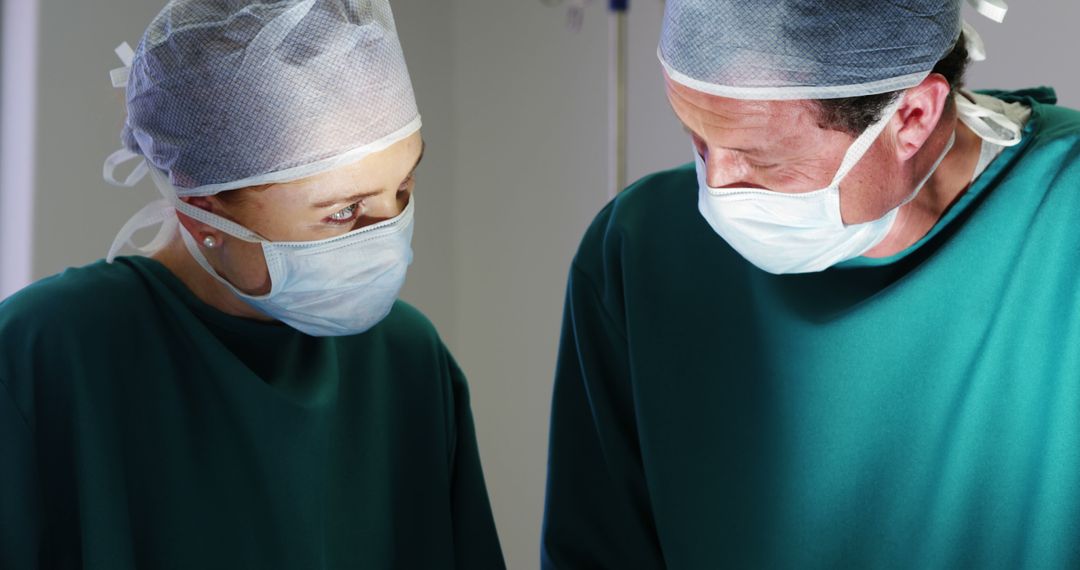 Surgeons in Operating Room Wearing Surgical Masks - Free Images, Stock Photos and Pictures on Pikwizard.com