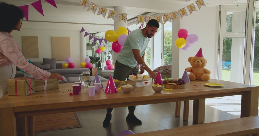Family Setting Up a Joyful Birthday Party at Home