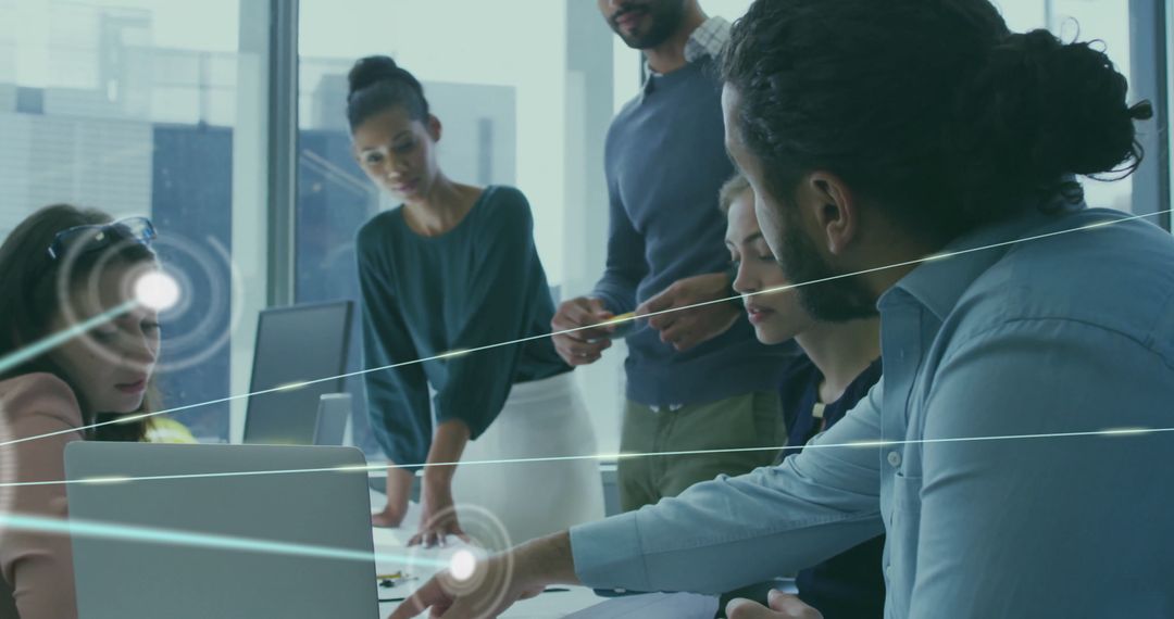 Diverse Team Collaborating on Networking Connections in Office