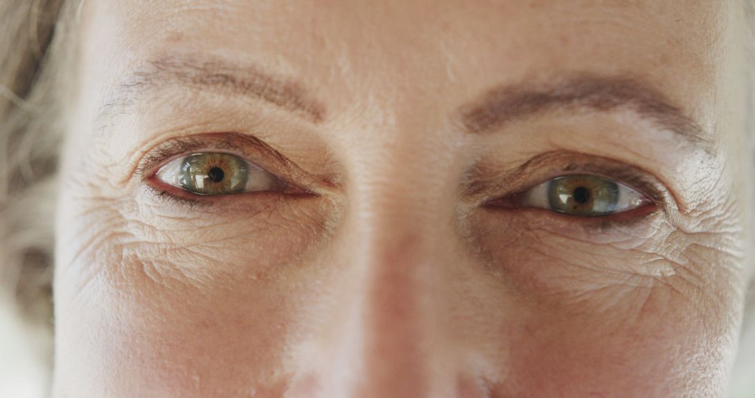 Close-Up of Mature Woman's Eyes with Wrinkles and Clear Vision - Free Images, Stock Photos and Pictures on Pikwizard.com