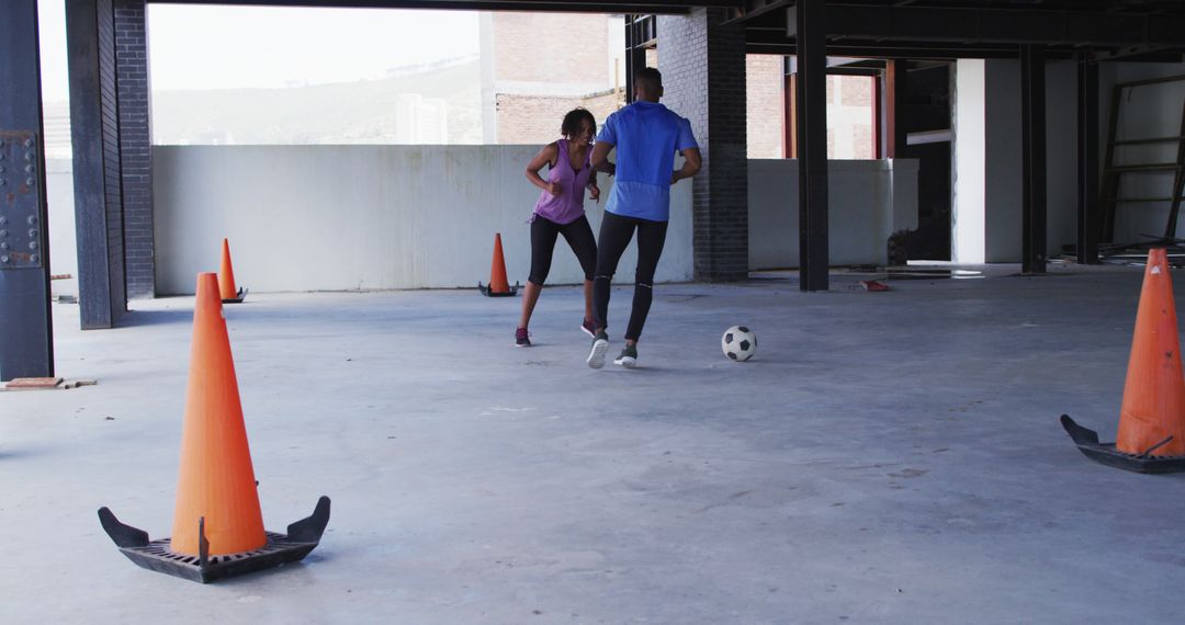 People Playing Soccer in Empty Building for Urban Fitness