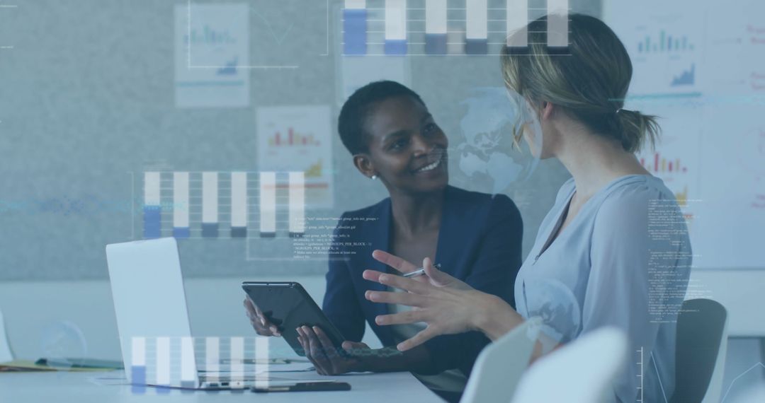 Professional Colleagues Analyzing Data with Digital Technology in Office