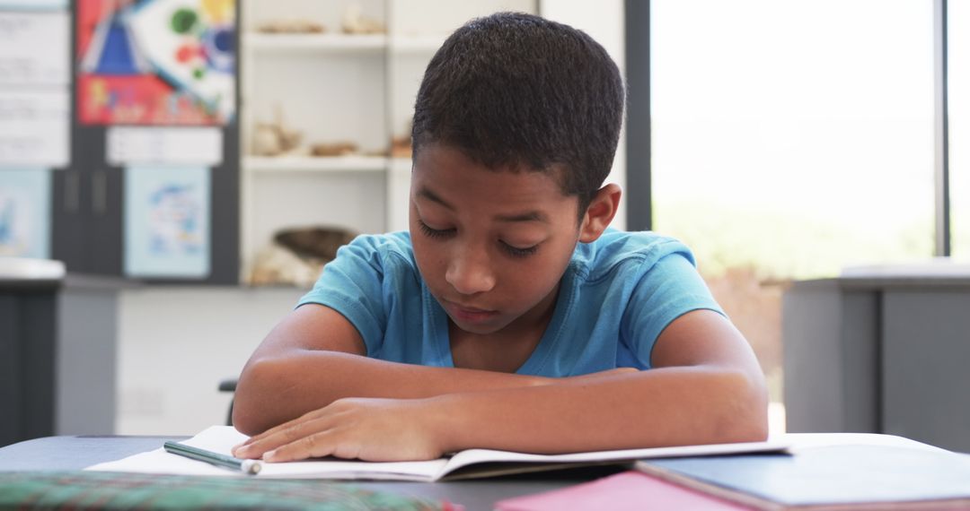 Young Student Focused on Class Assignment in Science Classroom