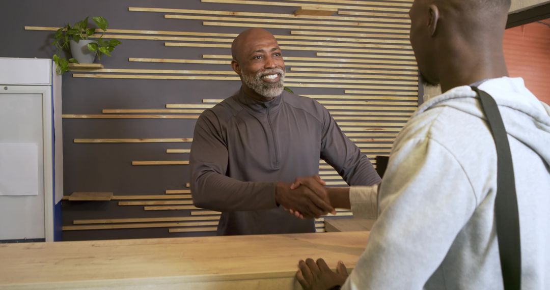Modern Reception Desk Greeting With Friendly Handshake