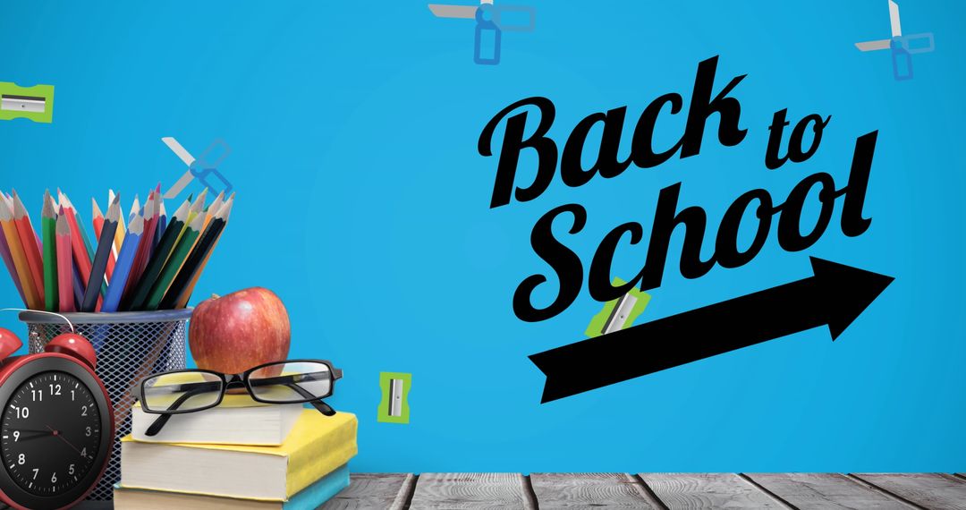 Back to School Theme with Supplies and Books on Desk