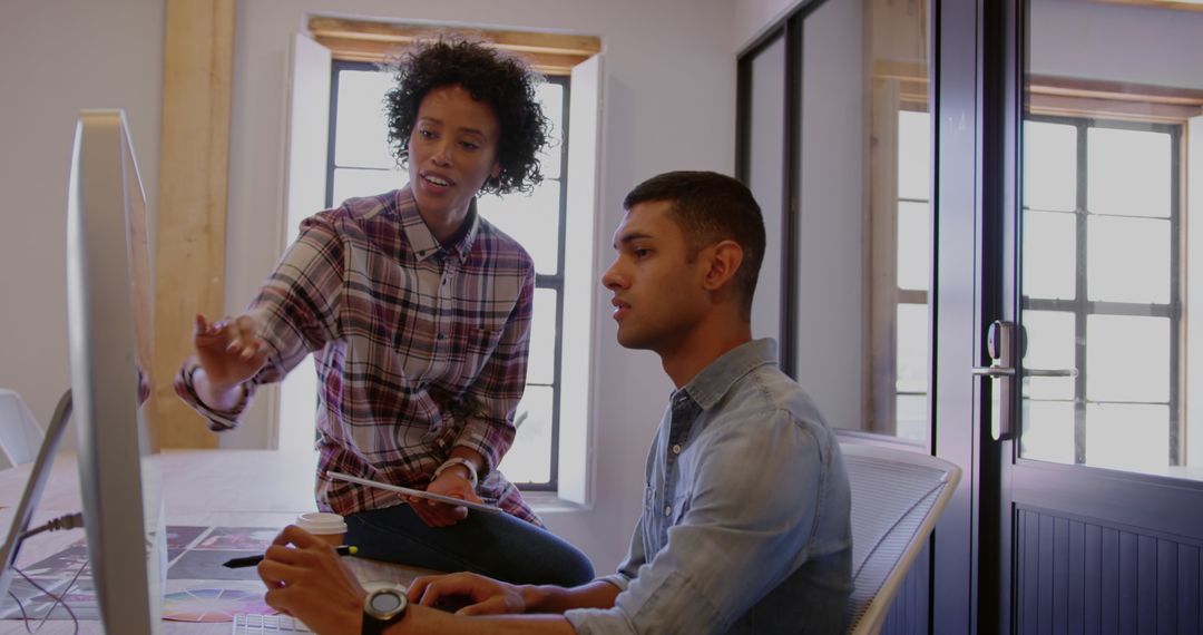Co-workers Collaborating in Casual Office Environment
