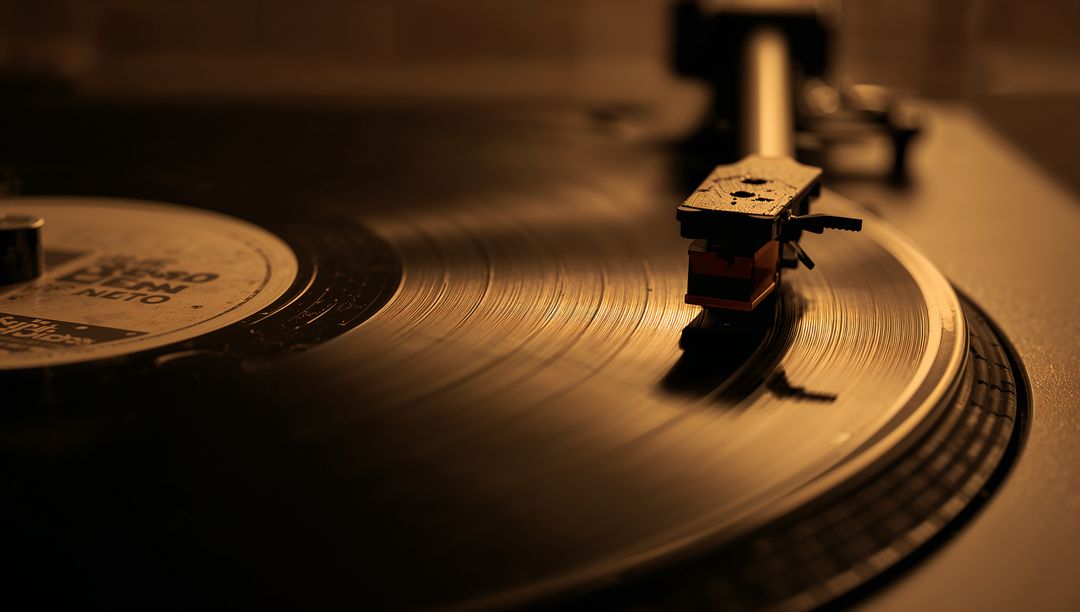 Warm Amber Vinyl Turntable Close-Up Showing Stylus on Spinning Record with Nostalgic Glow