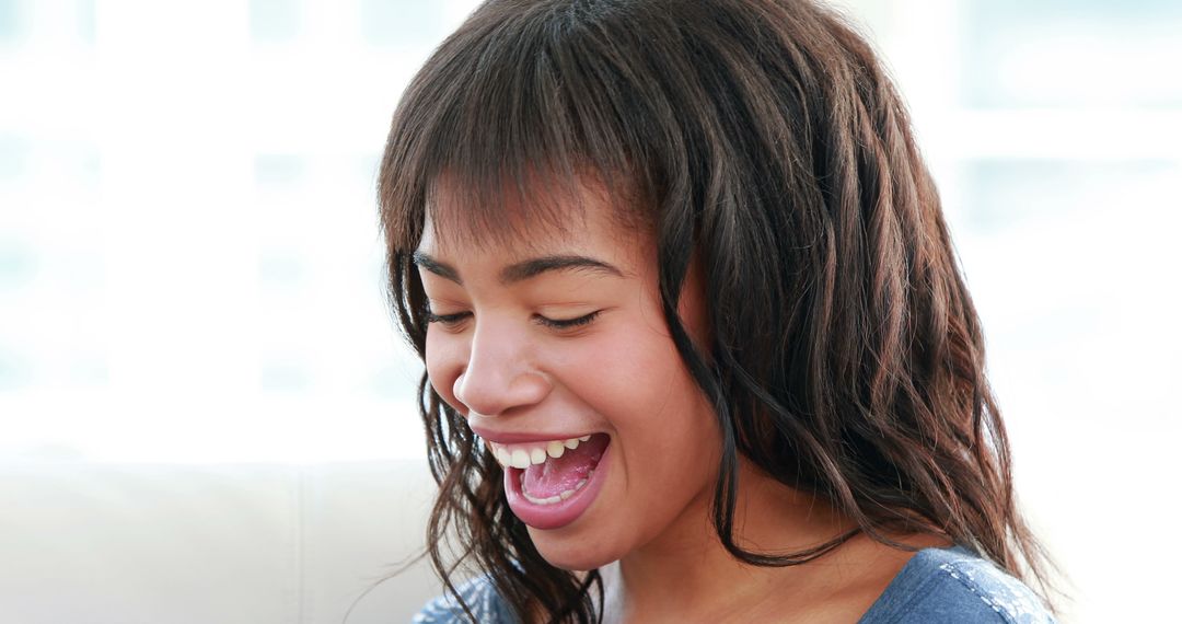 Joyful African American Girl Laughing with Bright Expression - Free Images, Stock Photos and Pictures on Pikwizard.com