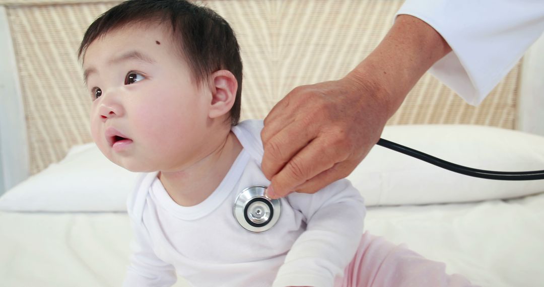 Pediatrician Examining Curious Infant with Stethoscope - Free Images, Stock Photos and Pictures on Pikwizard.com