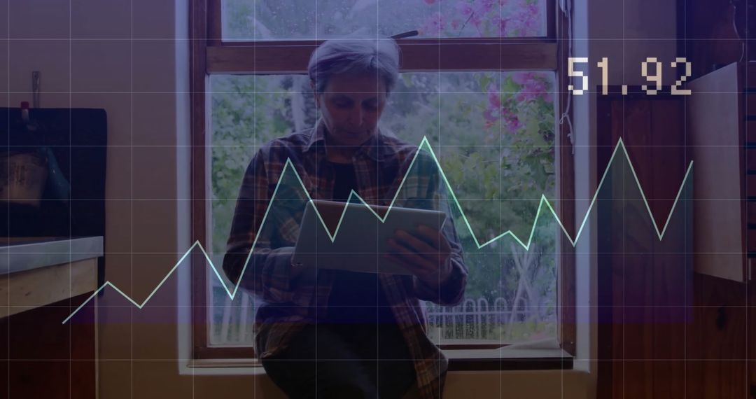 Senior Woman Analyzing Data on Digital Tablet