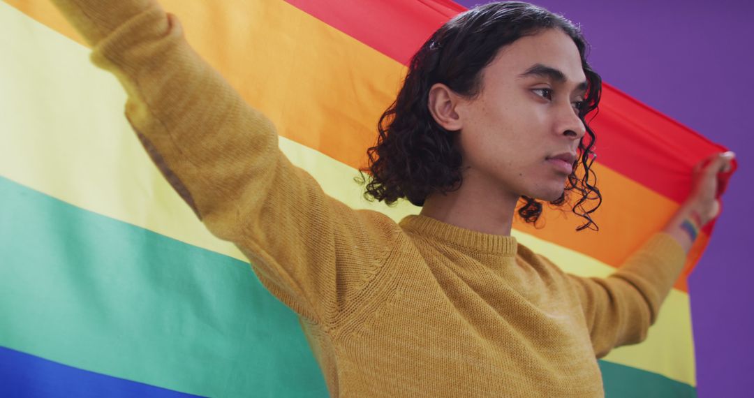 Confident Person Holding LGBTQ+ Pride Flag - Free Images, Stock Photos and Pictures on Pikwizard.com