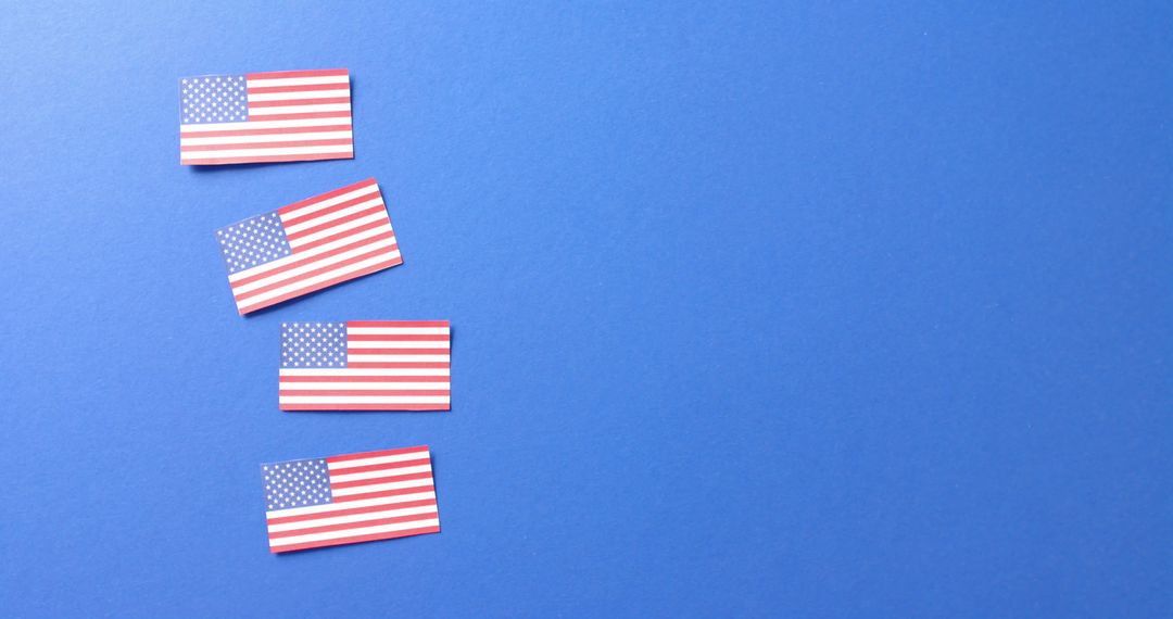 Row of American Flags on Blue Background with Copy Space