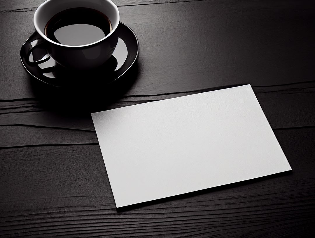 Black Coffee Cup Next to Empty Paper Sheet