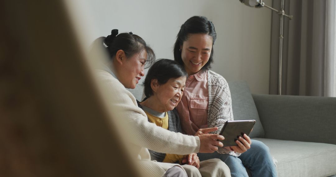 Multigenerational Family Using Tablet for Digital Connectivity