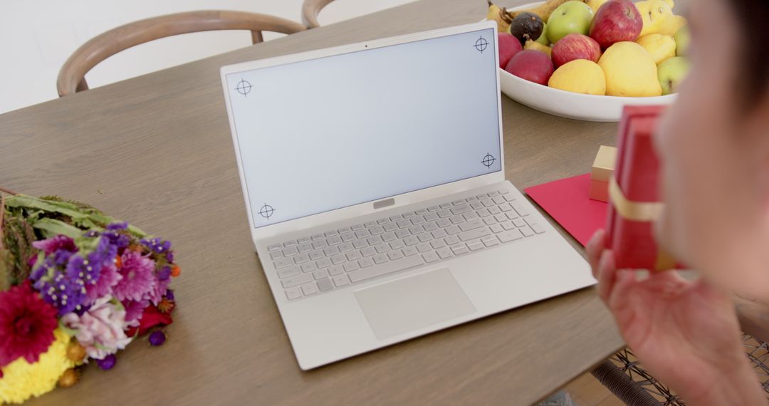 Man Having Video Call with Laptop on Wooden Table