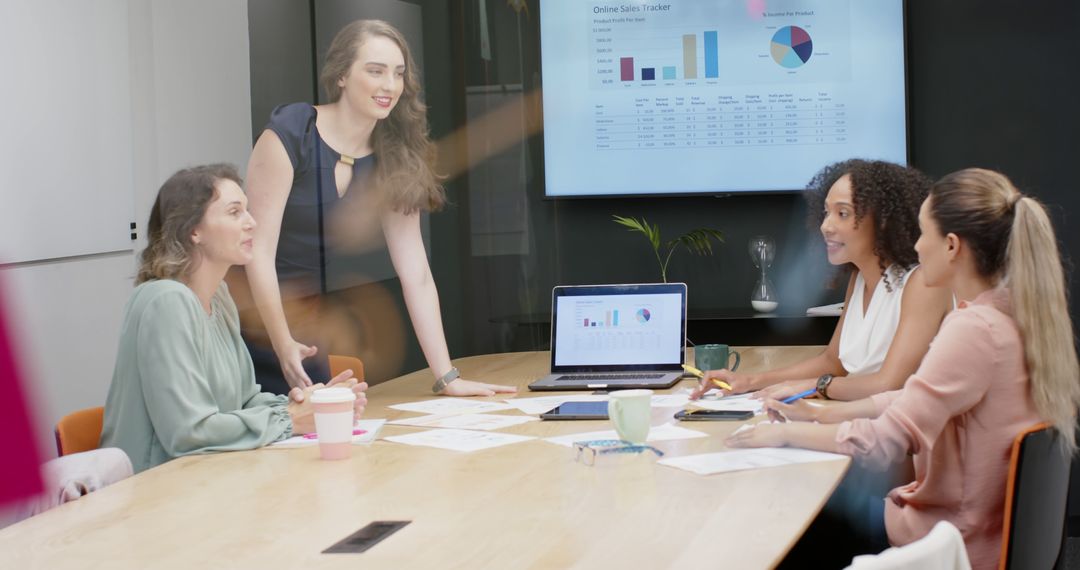 Diverse Female Team Collaborating in Modern Office Meeting