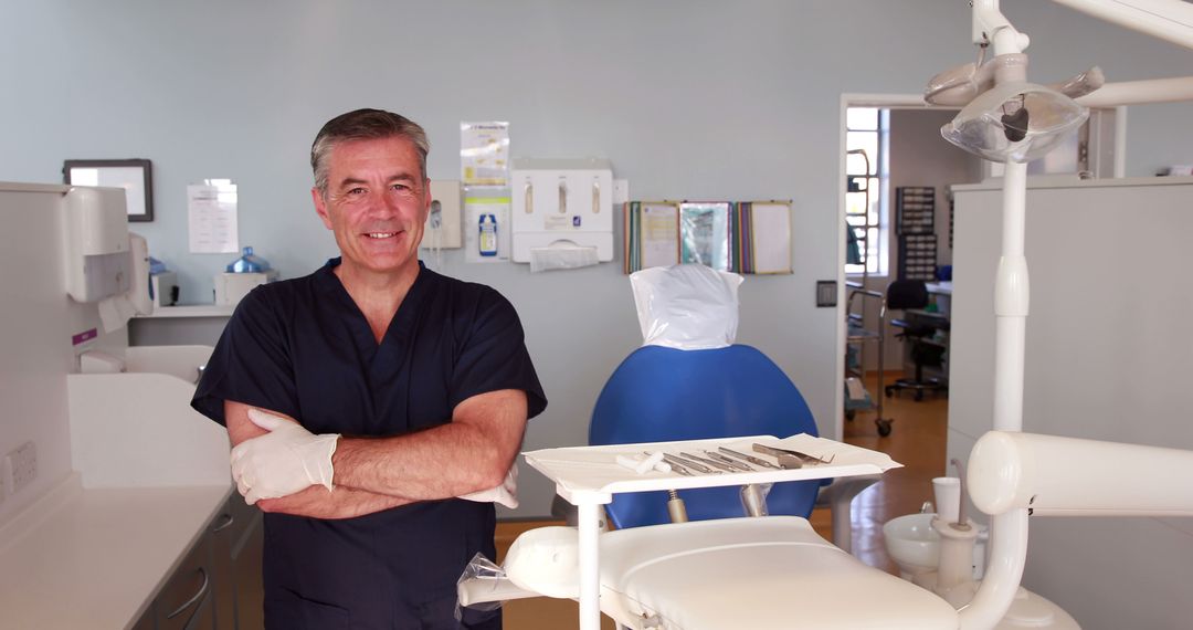 A middle-aged Caucasian male dentist stands confidently in his clinic, with copy space - Free Images, Stock Photos and Pictures on Pikwizard.com