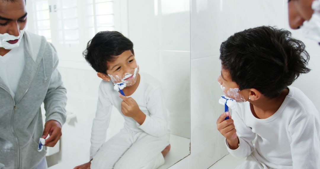 Father and Son Shaving Together in Bathroom Vanity Mirror Reflection - Free Images, Stock Photos and Pictures on Pikwizard.com