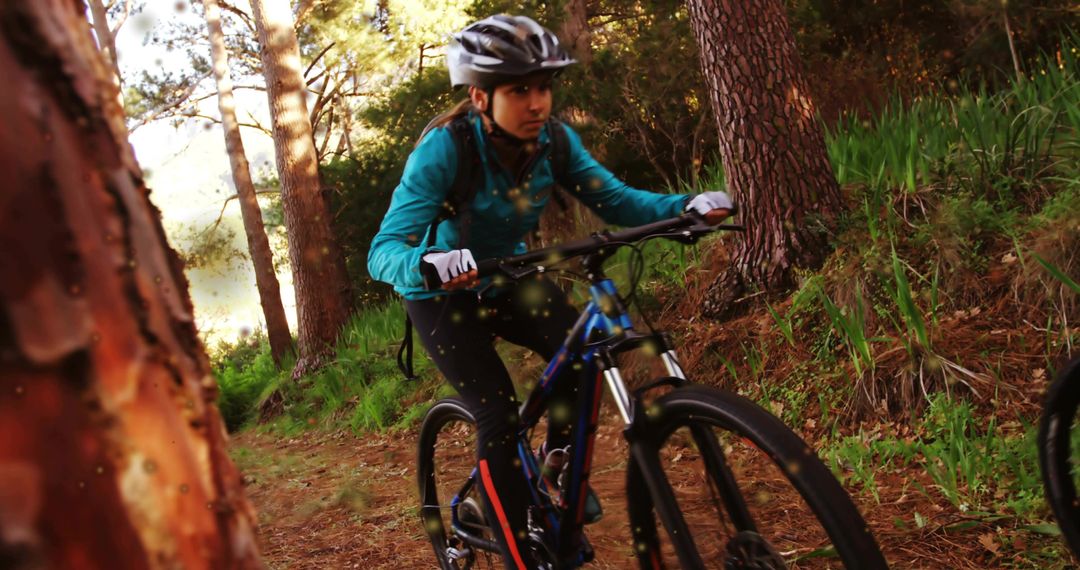 Woman navigating pine forest trail on mountain bike wearing helmet and backpack