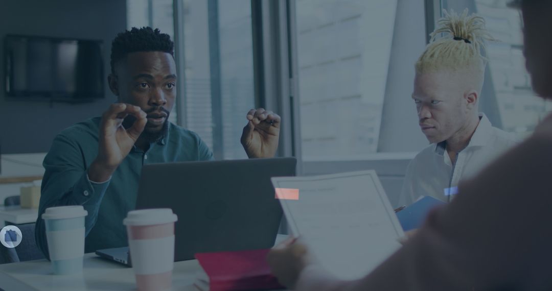 Diverse Team Analyzing Business Data in Modern Office Setting