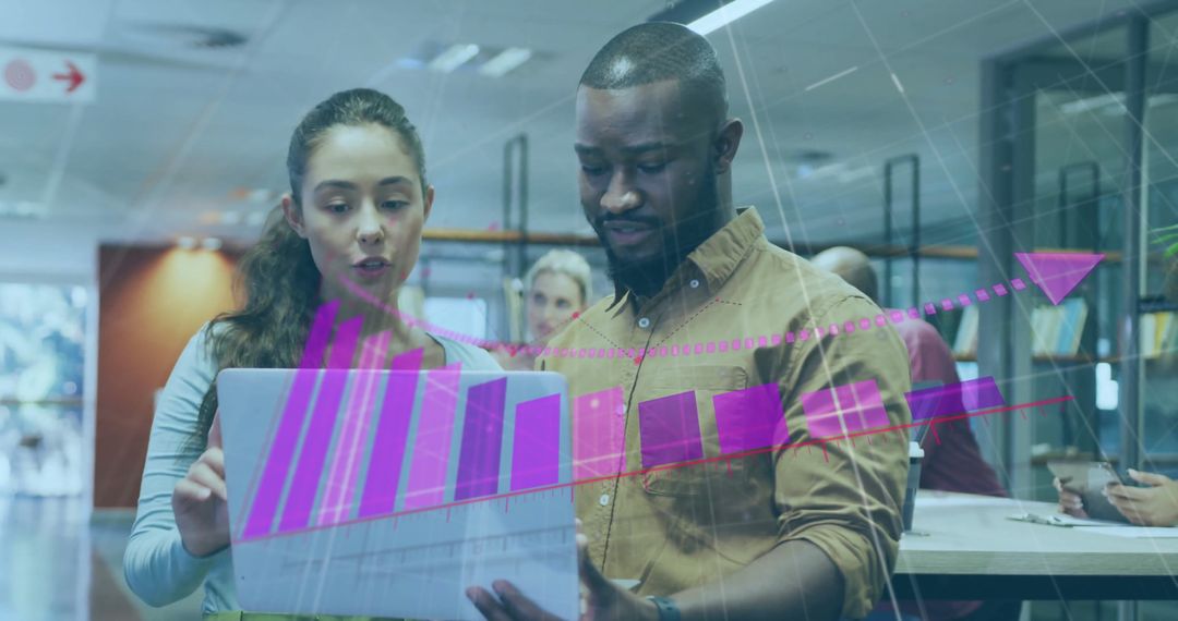 Diverse Colleagues Analyzing Digital Graph in Office Environment