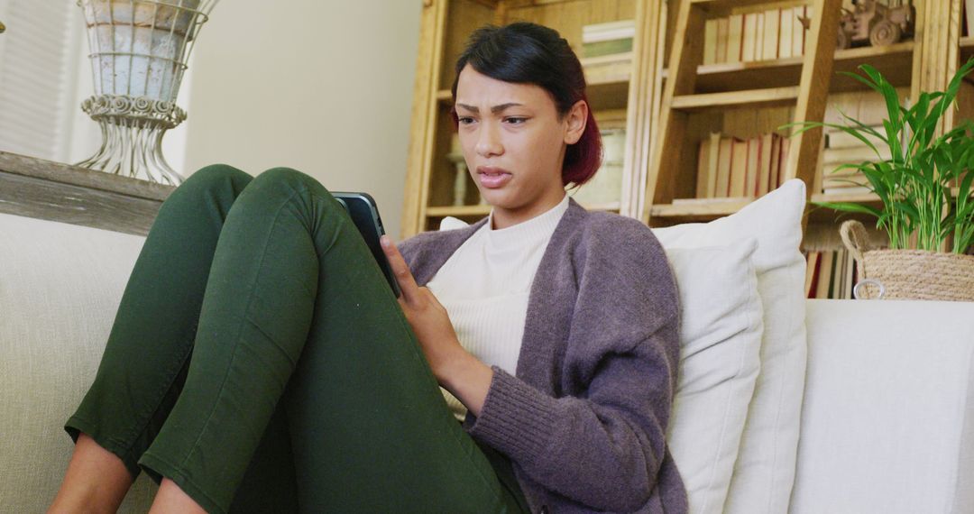 Young Woman Focused on Digital Tablet Browsing at Home - Free Images, Stock Photos and Pictures on Pikwizard.com