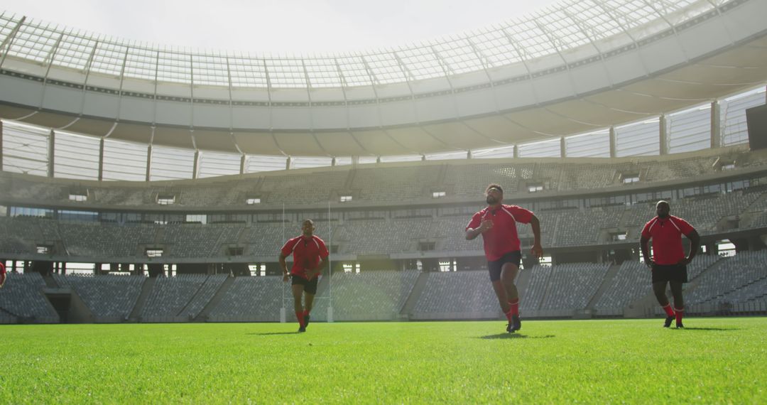 Rugby Players Practicing Running Drills in Stadium - Free Images, Stock Photos and Pictures on Pikwizard.com