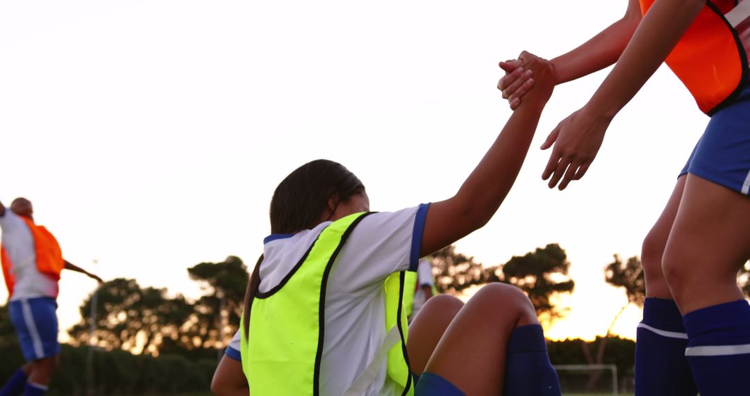 Sportsmanship in Youth Soccer Team Training at Sunset - Free Images, Stock Photos and Pictures on Pikwizard.com