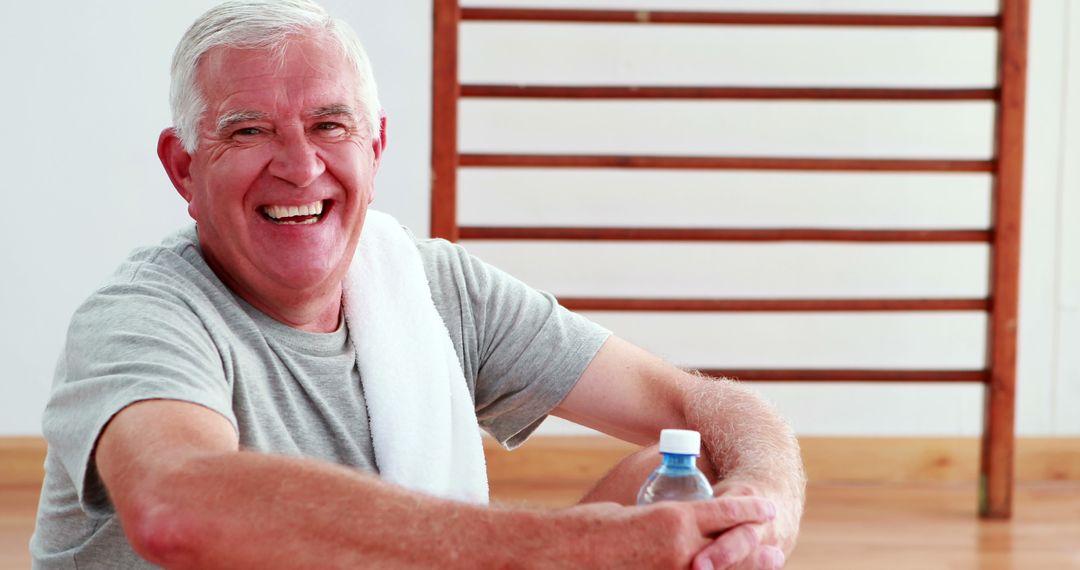 Smiling Senior Man Resting After Workout with Water Bottle - Free Images, Stock Photos and Pictures on Pikwizard.com