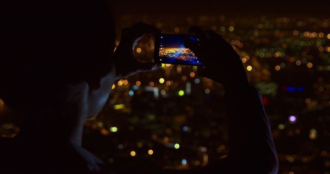 Person Taking Night Photo of Cityscape with Smartphone - Free Images, Stock Photos and Pictures on Pikwizard.com