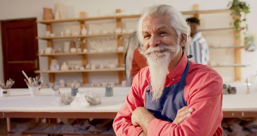 Smiling Senior Man in Pottery Studio Wearing Apron - Free Images, Stock Photos and Pictures on Pikwizard.com