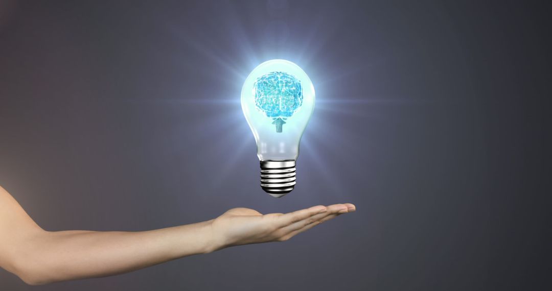 Hand Holding Lightbulb with Brain Symbol on Gray Background